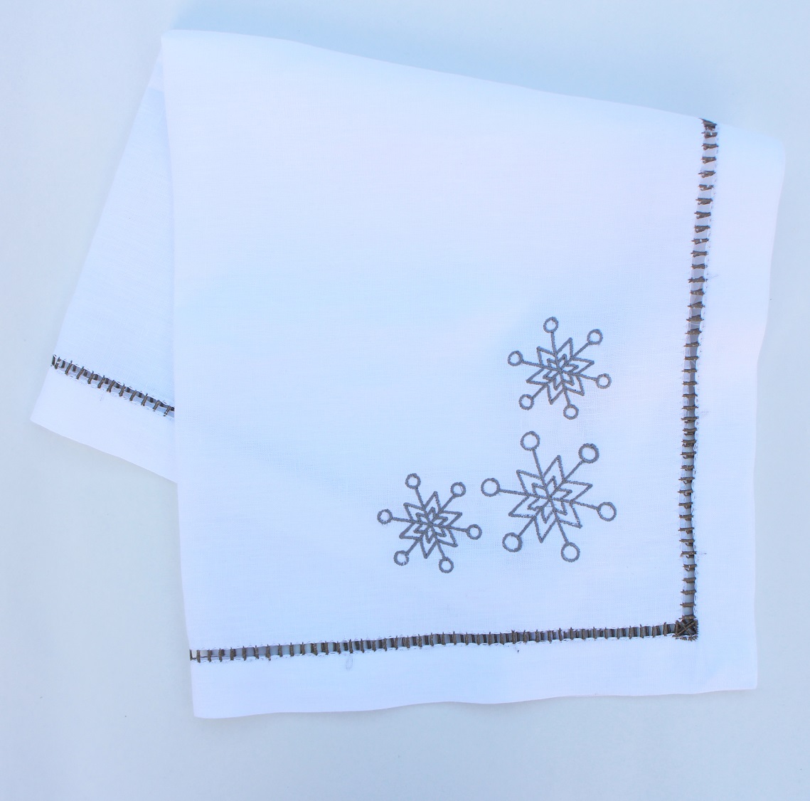 Snowflake embroidered Christmas dinner napkin with hand hemstitch